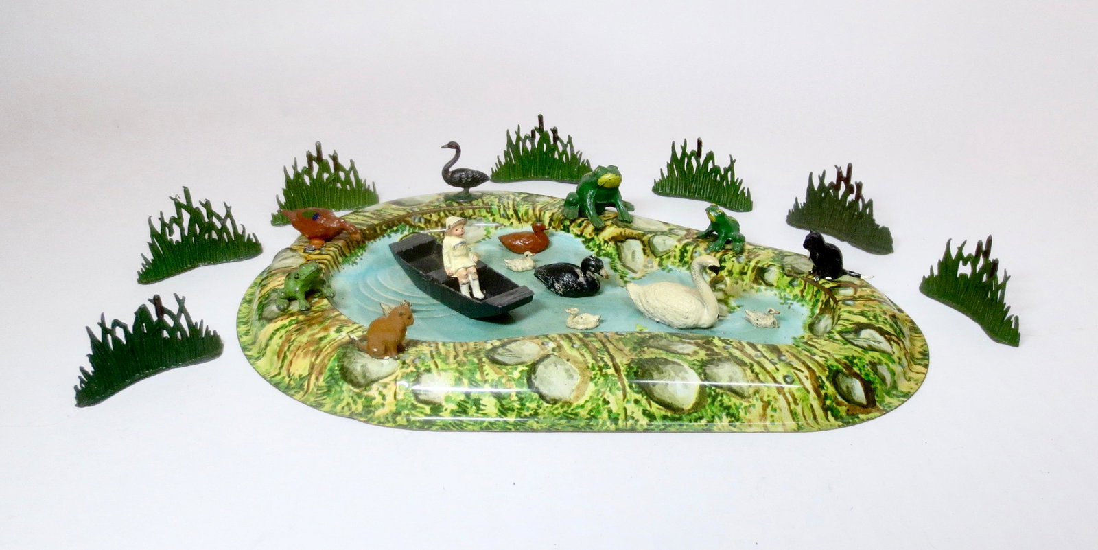 Johillco Girl in Punt on Pond: Lovely pastoral collection of figures from Johillco, Britains and others with tin Pond. 24 pieces. Excellent condition. Unboxed.