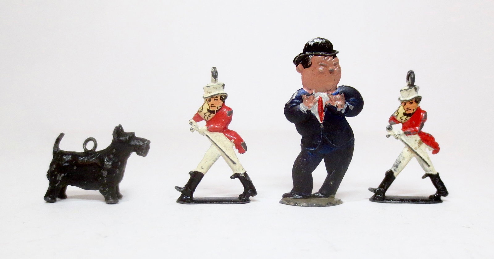 Britains and Mignot Selection: Britains Johnny Walker promotional figures, Mignot Oliver Hardy, and a Scottie Dog by an unidentified maker. 20mm-40mm tall. 4 pieces. Excellent condition. Unboxed.