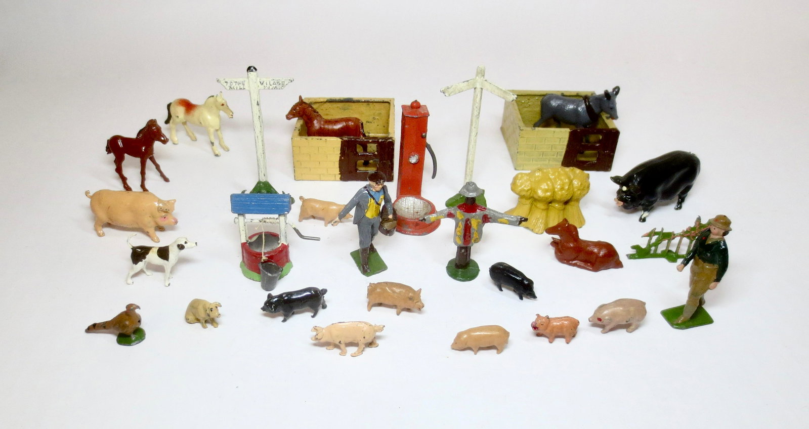 British Hollowcast Farm Assortment: Britains Farmer throwing seed, Land Girl, plus a variety of animals and accessories. 29 pieces. Excellent condition. Unboxed.