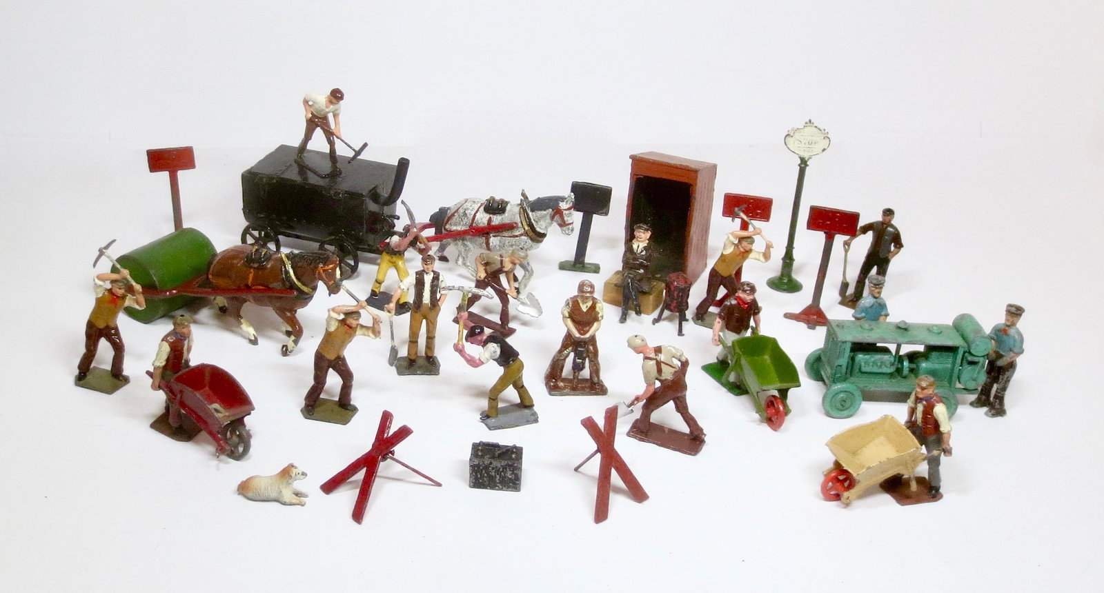 British Makers Road Work Assortment: Charbens Horse drawn Pitch Boiler, Road Roller & Workmen, and a large assembly of figures and accessories from Britains, Johillco, and Crescent. 38 pieces. Excellent overall condition (horse carts are