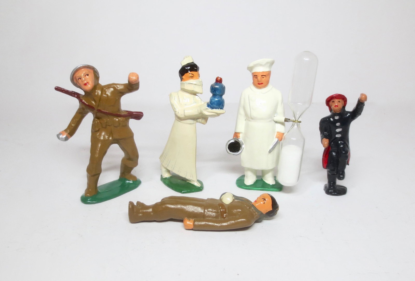 Eccles Dimestore Soldiers: Grenade Thrower, Nurse, Wounded, Fireman, and Egg Timer. 5 pieces. Mint condition. Unboxed.