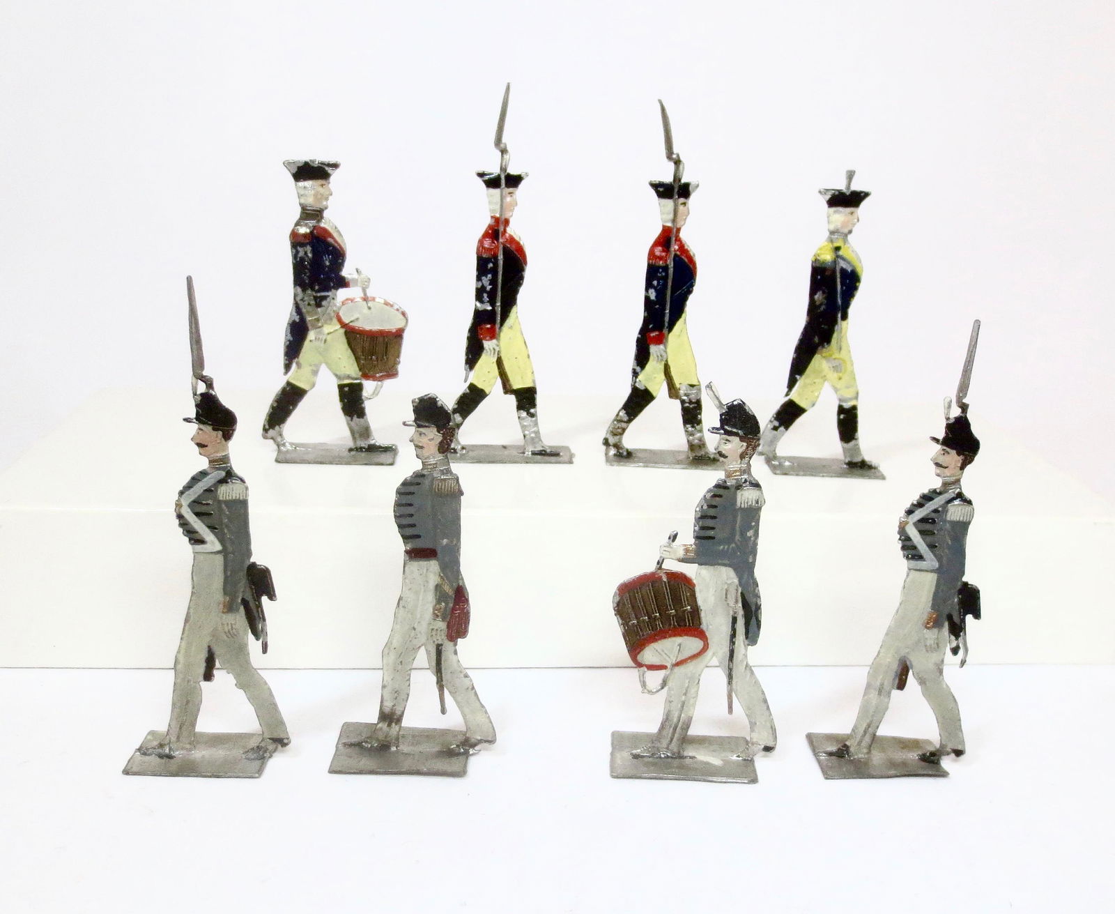 RARE Large Scale Early German Tin Flats: American Revolutionary War Officer, Drummers and Infantry. Plus West Point Cadets Officer, Infantry and Drummer. 70mm tall. 8 pieces. Very good condition (one figure missing plume). Unboxed.