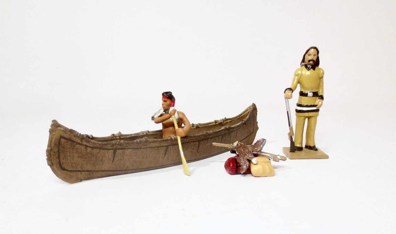 CBG American West Figures: Indian Brave paddling canoe, and American Scout with accessories. 5 pieces. Near mint to excellent condition. Unboxed.