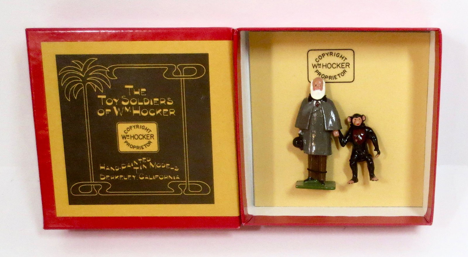 Hocker #402 "Origin Of The Species": A whimsical tribute to Charles Darwin's 200th Birthday, and to 500 plus years of the ascent of science over superstition. Darwin with Monkey. 2 pieces. Mint condition. Box excellent.
