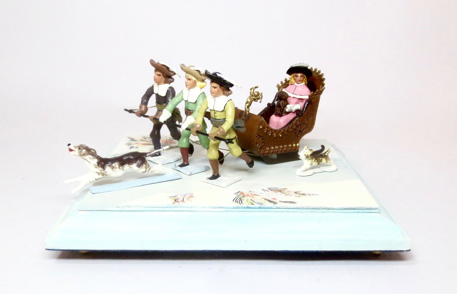 Mignot "Chars de Venus": Lovely "Chariot of Venus" set. Trio of enamored Boys pull a Beautiful Girl's Sleigh as her dogs run astride. 5 pieces. Mint condition, in a plain craft box.