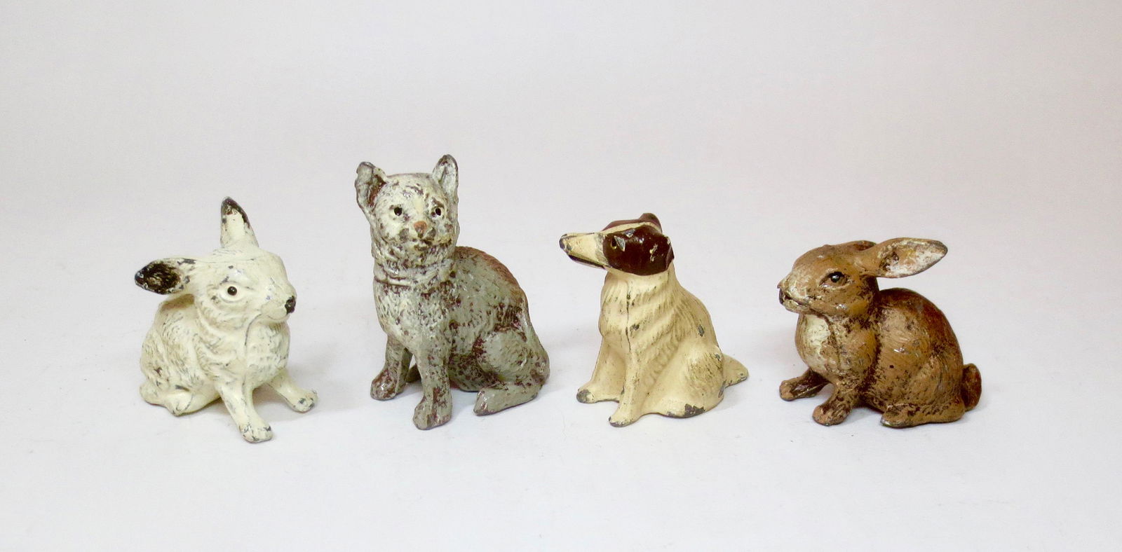 Assorted Animals: Heyde or similar maker. Dog, Cat, and Bunnies. 40mm-45mm tall. 4 pieces. Excellent condition. Unboxed.