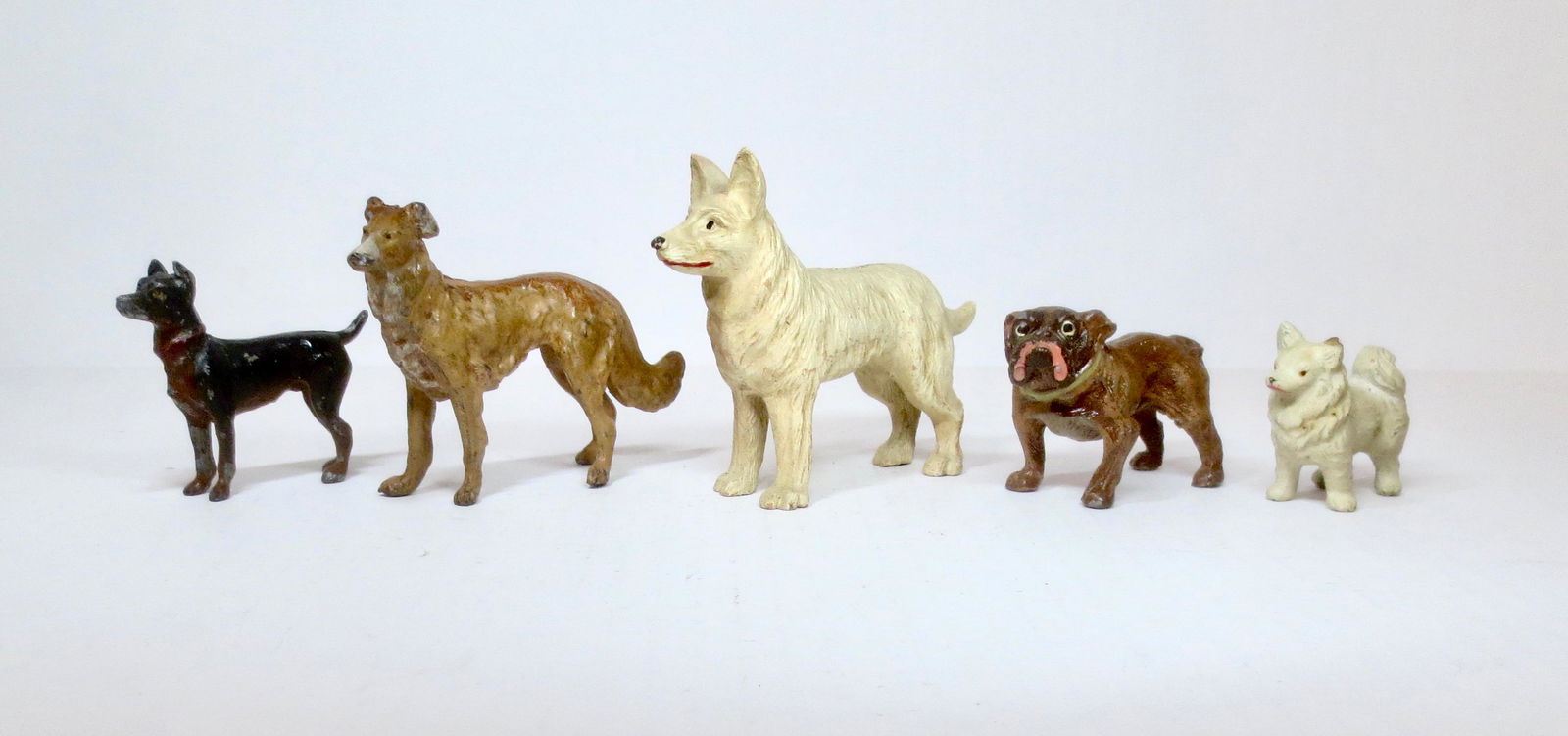 Assortment of Dog Breeds: Heyde or similar makers. Largest is a souvenir from Mackinac Island. 45mm to 85mm tall. 5 pieces. Excellent condition. Unboxed.