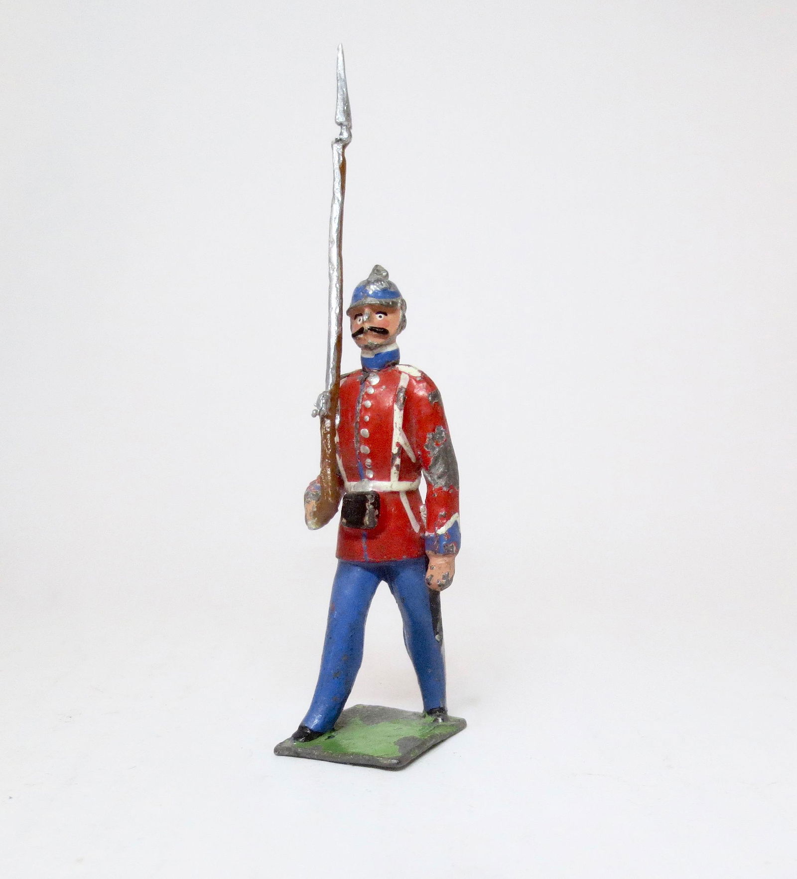 Heyde Large Scale Line Infantry Figure: Marching at the slope in red tunic and spiked helmet. 70mm tall. Very good condition. Unboxed.