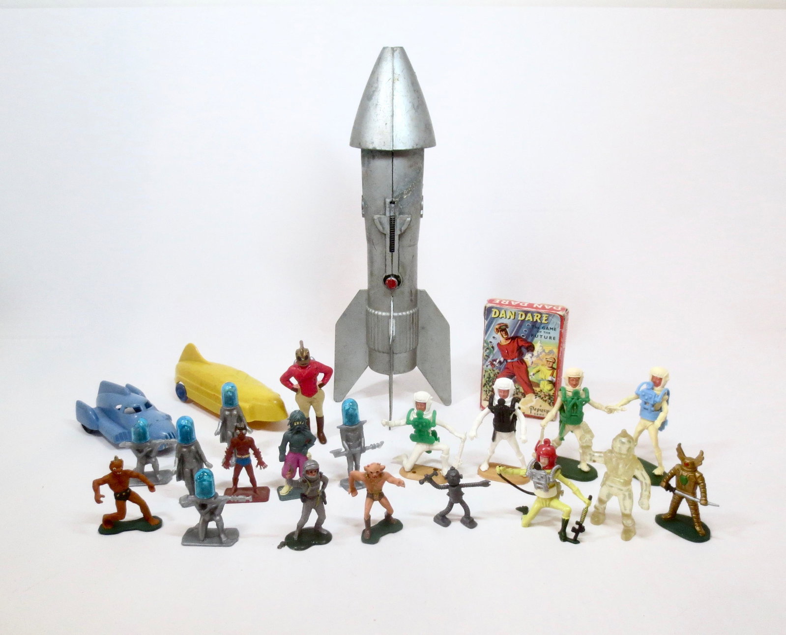 Large Space Collection: Dan Dare Card Deck, 11-1/2" Metal Rocket, and a variety of plastic Astronauts and Aliens from Cherilea, Starlux and more. 23 pieces. Excellent condition. Unboxed.