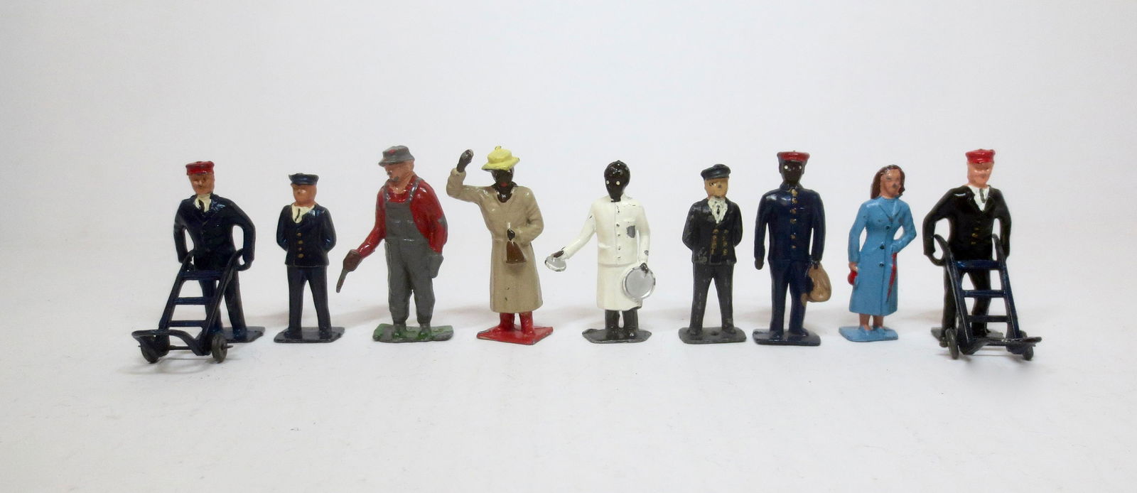 Crescent Railway Figures: Station Masters, Porters, Pullman Waiter with Tray, and Passengers. 11 pieces. Excellent condition. Unboxed.