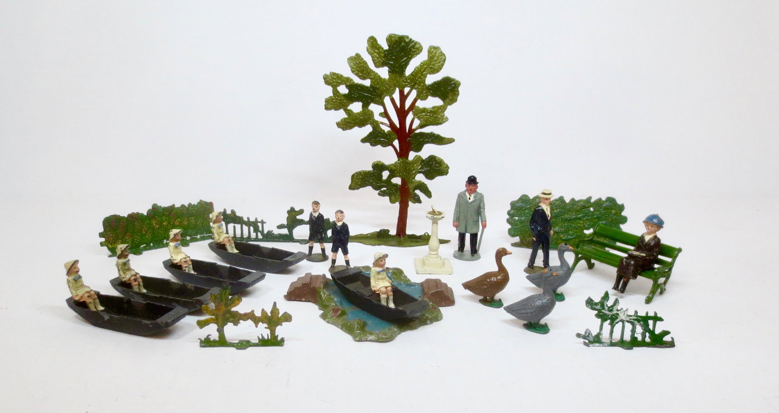 British Makers Farm & Village Assortment: A Day in the Park including Johillco Girls in Punts, School Boys, Dapper Gent in Straw Boater, and more. 27 pieces. Excellent condition (four punts missing middle seats). Unboxed.