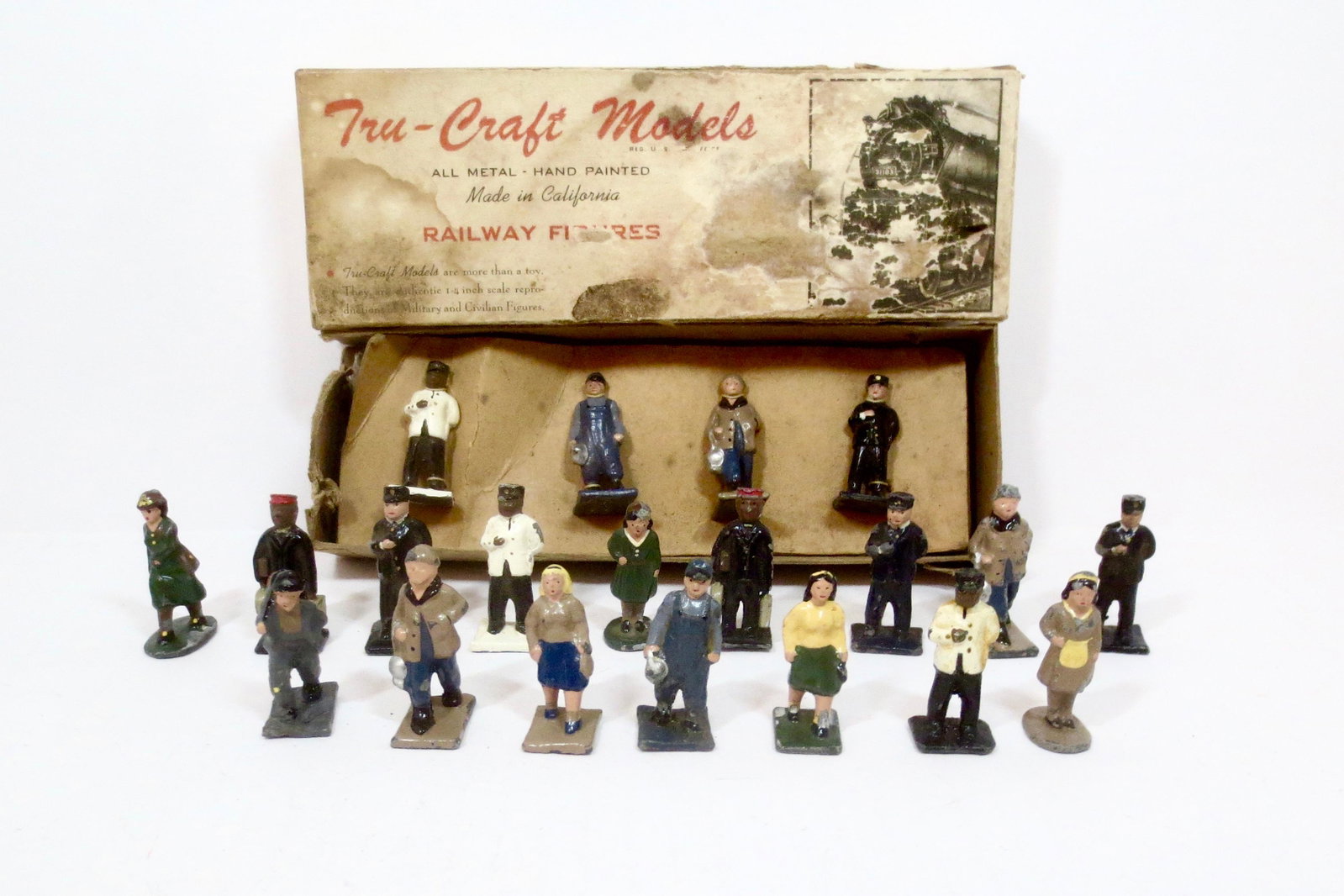 Trucraft Railway Figures: Assorted train crew and passengers. 20 pieces. Near mint to very good condition. One box included, in poor condition.