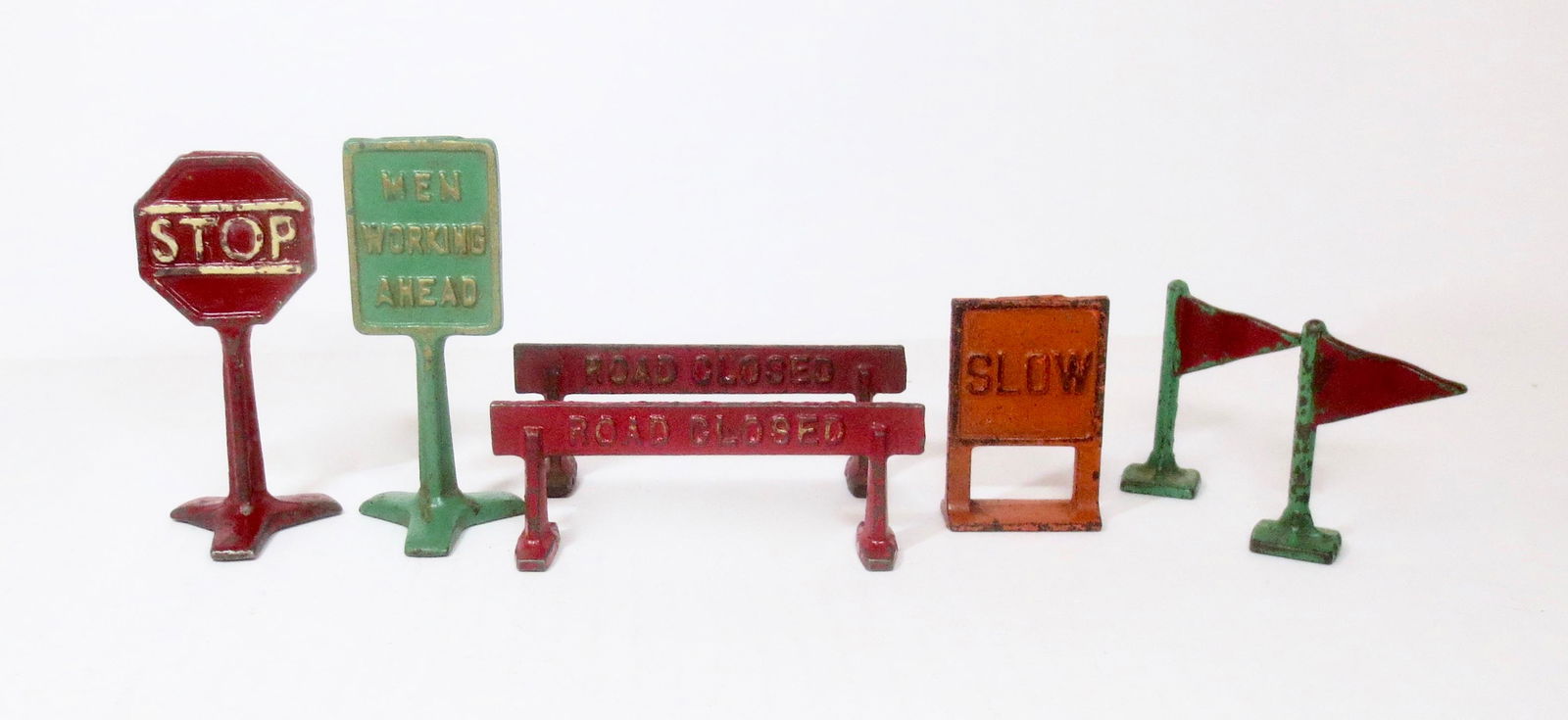 Cast Iron Road Signs: 7 pieces. 1-1/2" to 3-1/2" tall. Excellent to very good condition. Unboxed.
