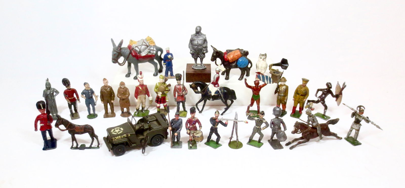 Pielin Emporium Assortment: Figures from Johillco, Heyde, France, Crescent, Japan, Timpo and more. Plus a Triang wind-up Jeep. 30 pieces. Excellent to very good condition (three figures are unpainted, one Heyde figure missing a