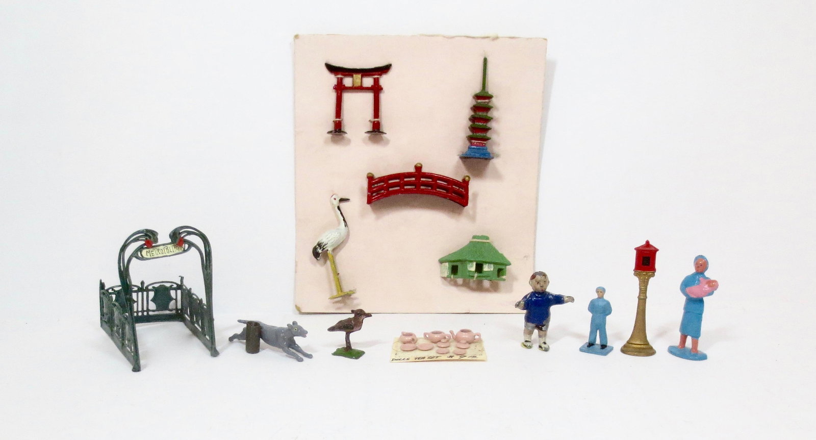 Pielin Emporium Miniatures Selection: Japanese Village Figures (mint condition tied to original card), Doll's Tea Set, Stoddart Baby, and more. 21 pieces. Mint to very good condition. Unboxed.
