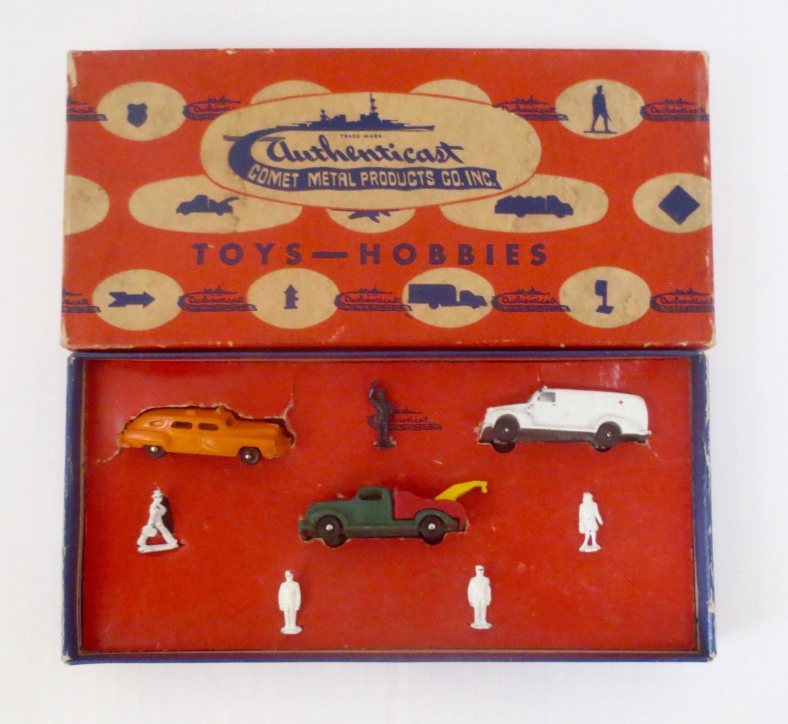 Authenticast HO Scale Road Set: Taxi, tow truck, ambulance and figures. 8 pieces. Excellent condition. Box fair (top corner splits and inner card tears).