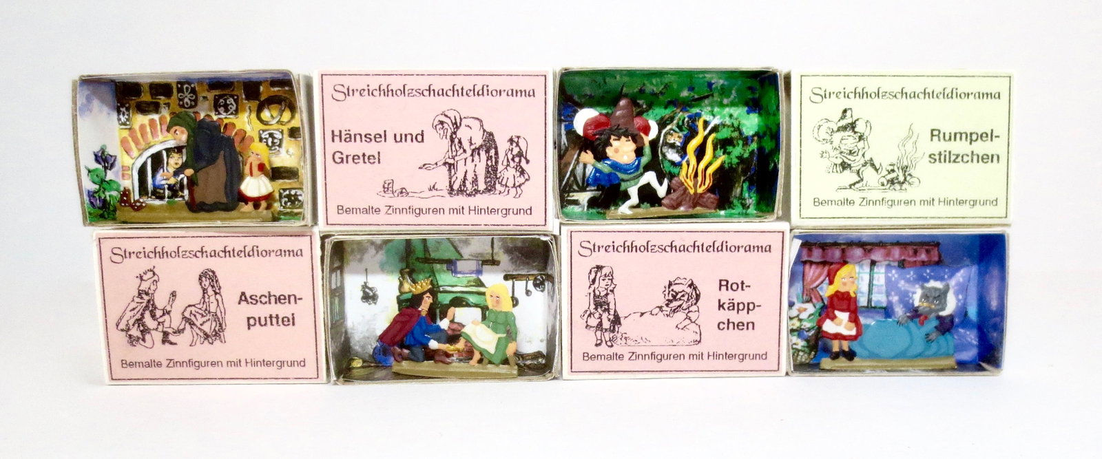 Bemalte Zinnfiguren Fairy Tale Tin Flats: Cinderella, Hansel & Gretel, Rumpelstilzchen, and Red Riding Hood. 25mm. Near mint condition in illustrated diorama boxes. Boxes excellent.