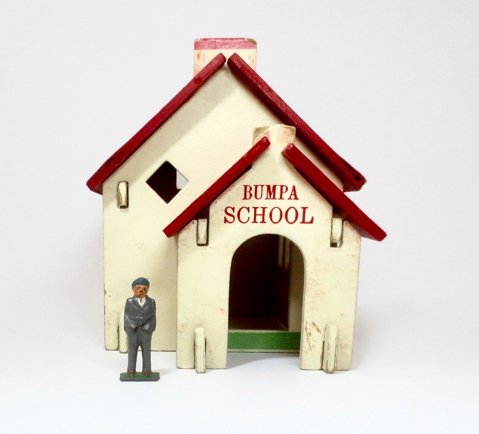 Bumpa School: Grey Iron school boy with Bumpa wooden school. Very good condition. Unboxed.