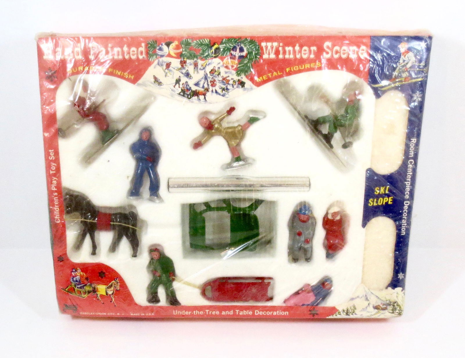 Barclay RARE "Winter Scene" Boxed Set: One horse open sleigh with a variety of sledding, skiing, and skating figures. 14 pieces. Mint condition, in original box with cellophane wrap. Box very good.