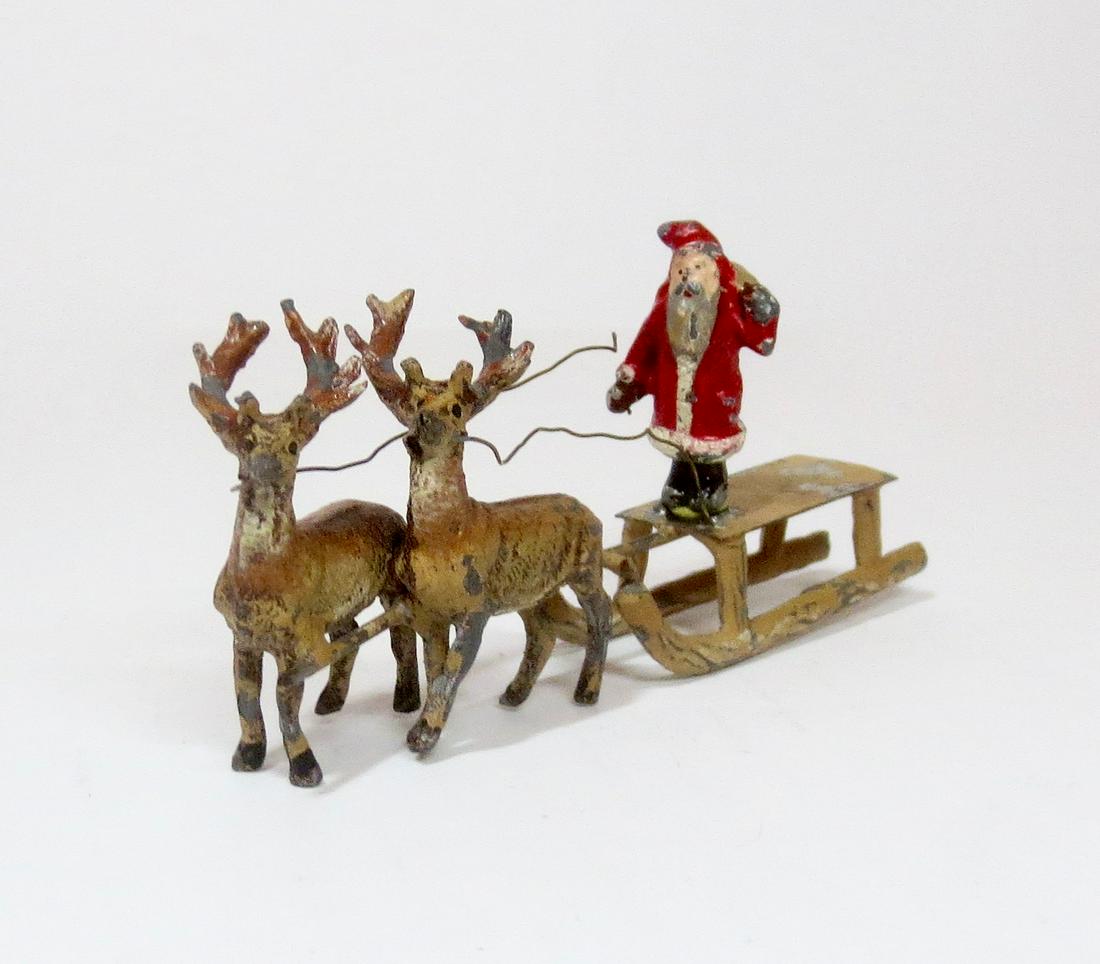 Heyde Santa on Reindeer-Drawn Sleigh: Scarce vignette. 40mm tall. Good condition (Santa loose from sleigh, and some paint loss). Unboxed.