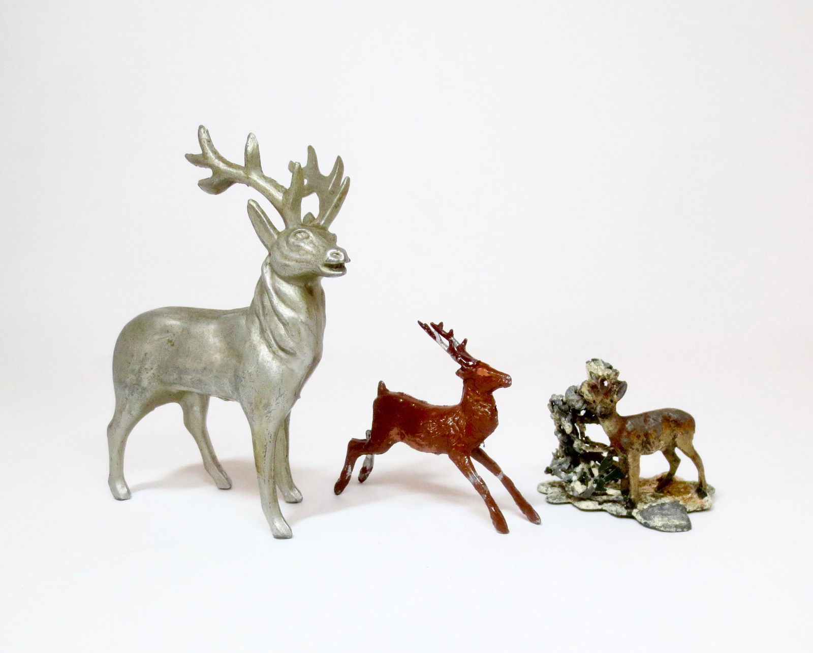 Trio of Reindeer Figures: Heyde and other makers. 45mm-111mm tall. Excellent to very good condition. Unboxed.