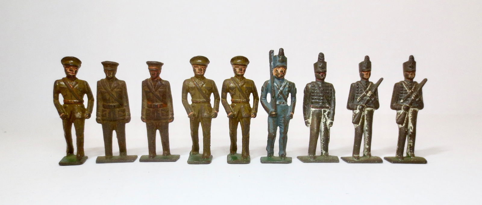 Grey Iron Military Figures: US Army, Marines, and West Point Cadets. 9 pieces. Fair to poor condition, with paint loss.
