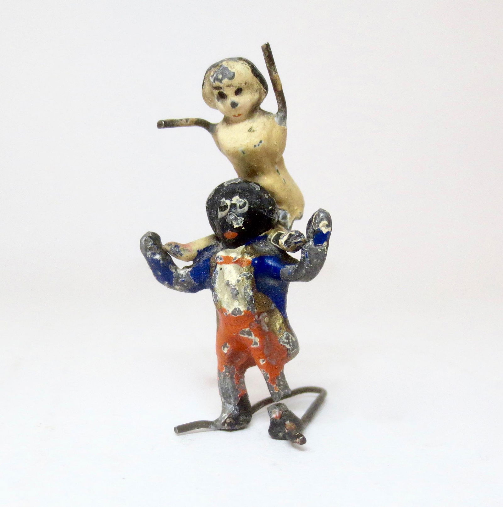 Heyde Gollywogg with Peg Doll on Shoulders: Based on the 1898 children's book by Florence Kate Upton. 40mm tall. Very good condition. Golly has a fracture in one leg. No box.