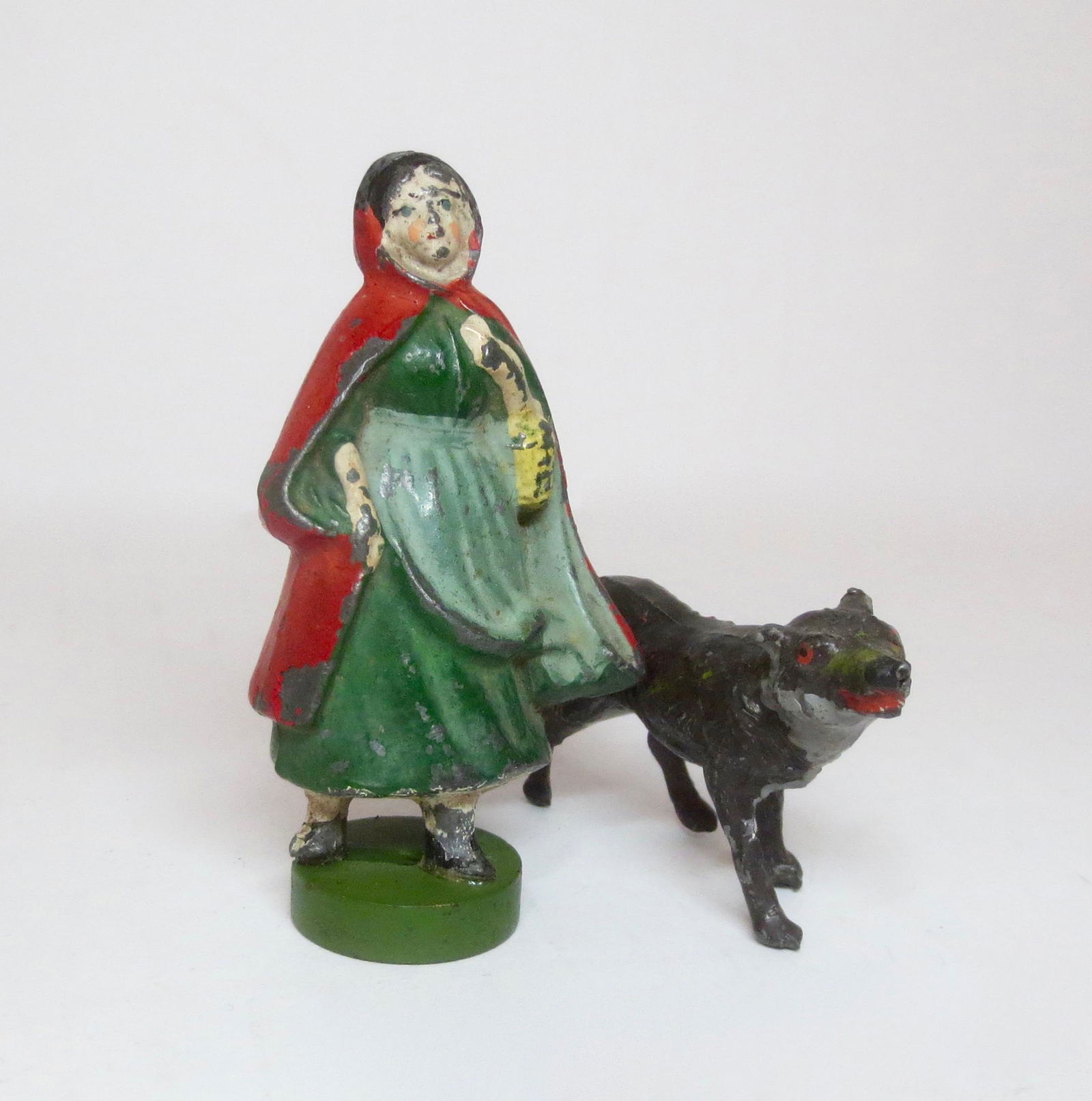 Heyde Large Scale Red Riding Hood & Wolf: Irish Souvenir girl in red cloak on wooden base paired with a hungry wolf. 80mm tall. Excellent condition. Unboxed.
