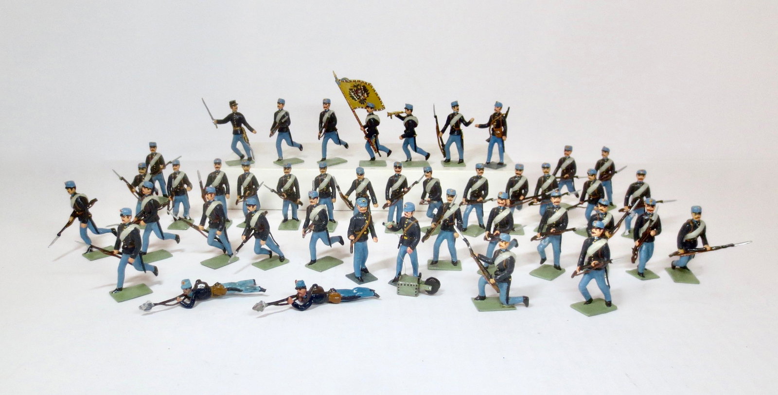 Wollner/Kober Austrian Infantry Charging: Post war (Austria) issue. 54mm. Complete set of hand-animated charging Austrian Imperial Infantry, including officer, flag, trumpeter, and field telephone team. 42 pieces. Near mint to excellent condi
