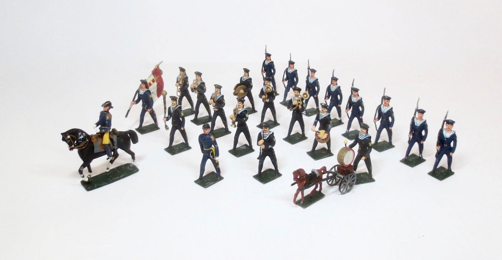 Wollner Navy Sailors and Band: Pre war (Austria) issue. 54mm. 11 sailors with mounted officer, flag bearer, and 12 piece band including drum pony & bandmaster. 23 total pieces. Near mint to excellent condition. Unboxed.