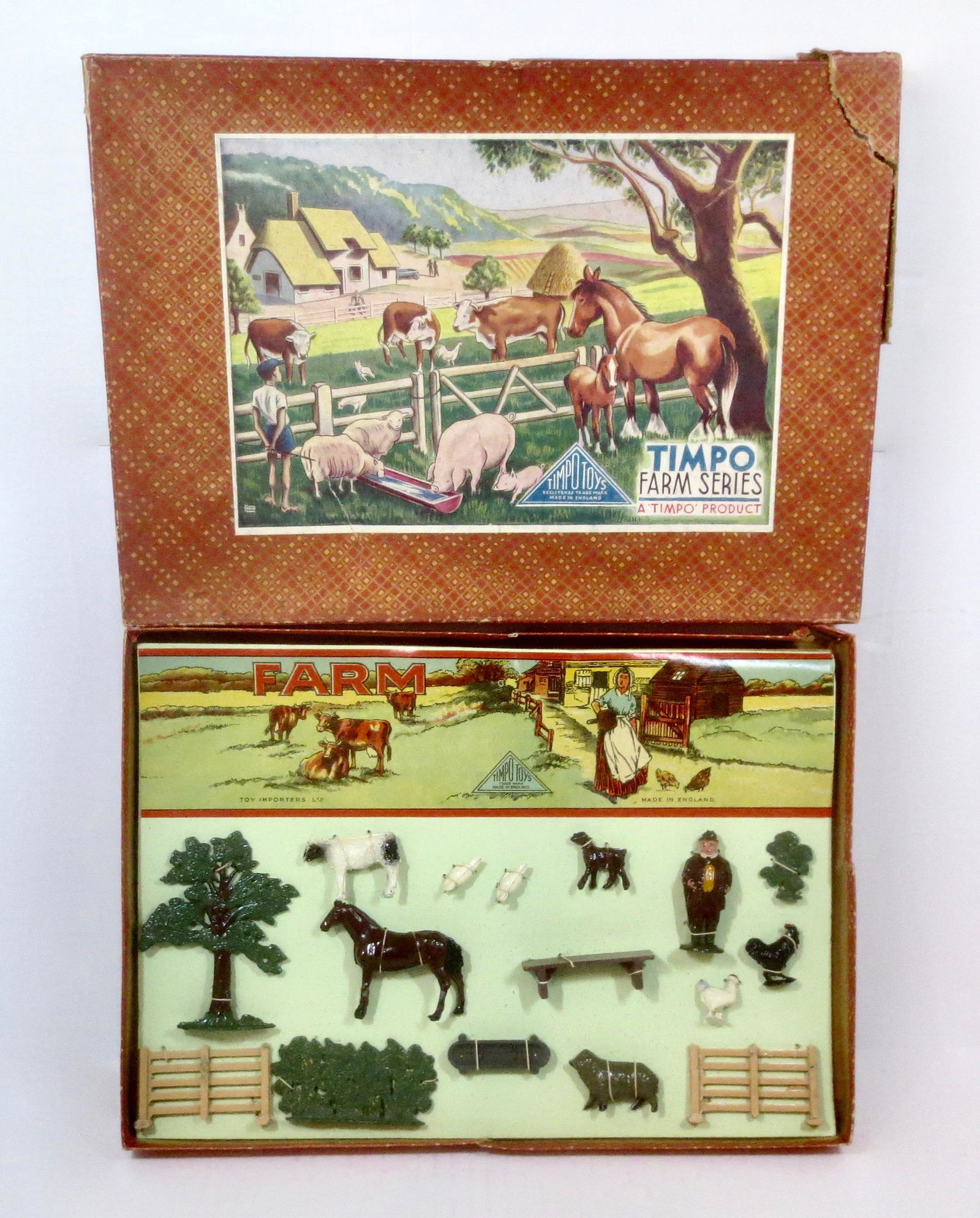 Timpo Farm Series Boxed Set: Charming Farm Display Set. Jolly Gentleman Farmer, with animals and accessories. 16 pieces. Mint condition, still tied to original illustrated card in box. Box good (top corner torn loose, included fo