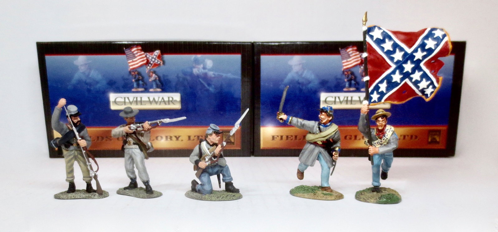 Conte American Civil War Boxed Sets: Confederate Infantry Firing Line #57099, and Confederate Flagbearer with Charging Officer #57104. 5 pieces. Excellent condition. Boxes excellent.
