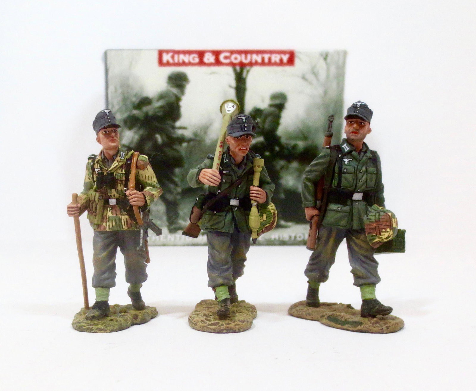 King & Country #WS119 “On the Road”: An NCO leads two of his riflemen to the front carrying extra ammo and weapons. Retired set. 3 pieces. Near mint condition. Box very good, with some shelf wear.