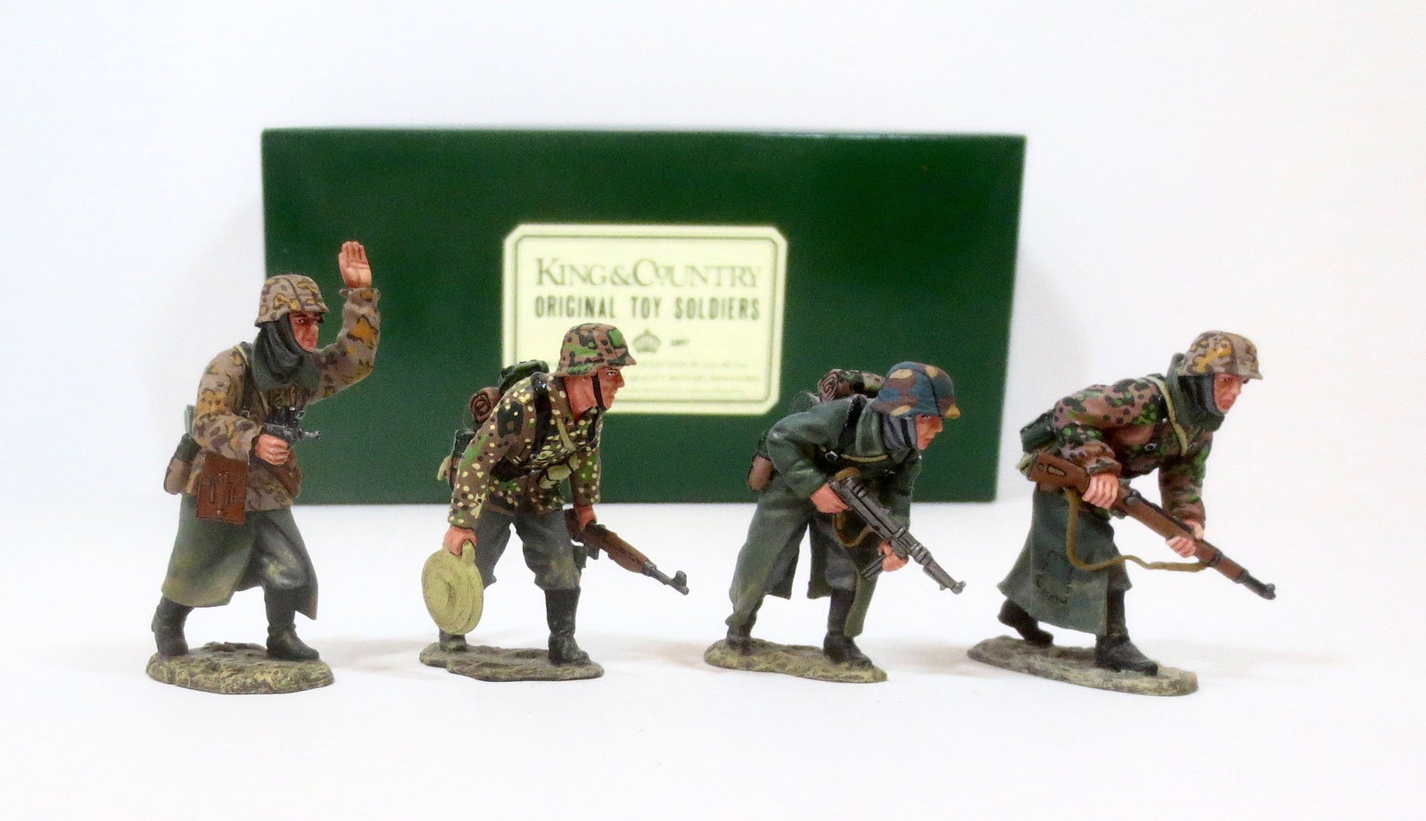 King & Country #WS048 Advance to Attack: Led by a pistol carrying officer, three SS Panzer Grenadiers cautiously move forward. Retired set. 4 pieces. Near mint condition. Box excellent.