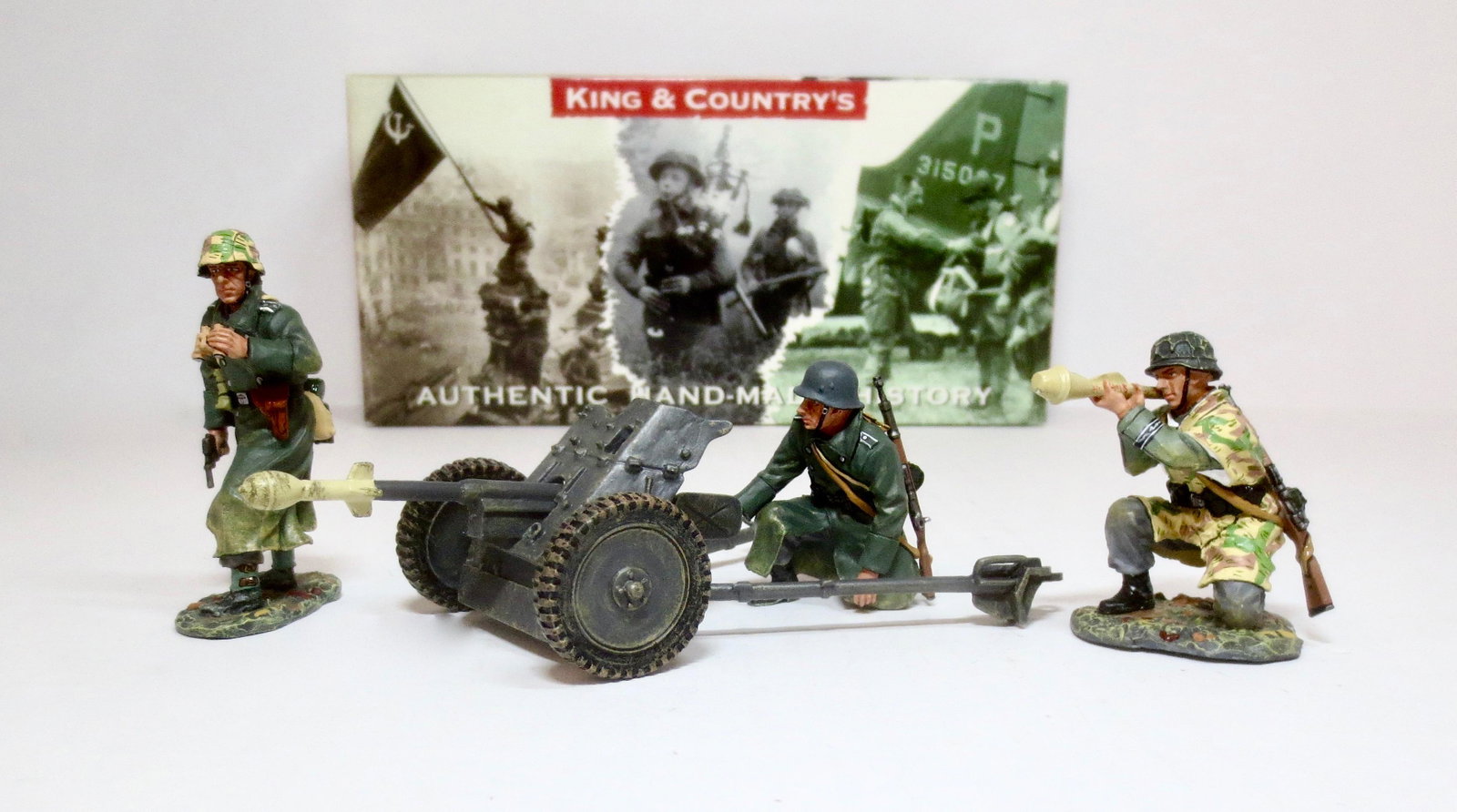 King & Country #WS066 Anti-Tank Gun Set: Two “Volksgrenadiers” man a small 37mm Anti-Tank Gun Specially modified to fire the Panzerfaust rocket. Another kneeling Grenadier is shoulder-firing the same weapon. 4 pieces. Retired set. Mint c