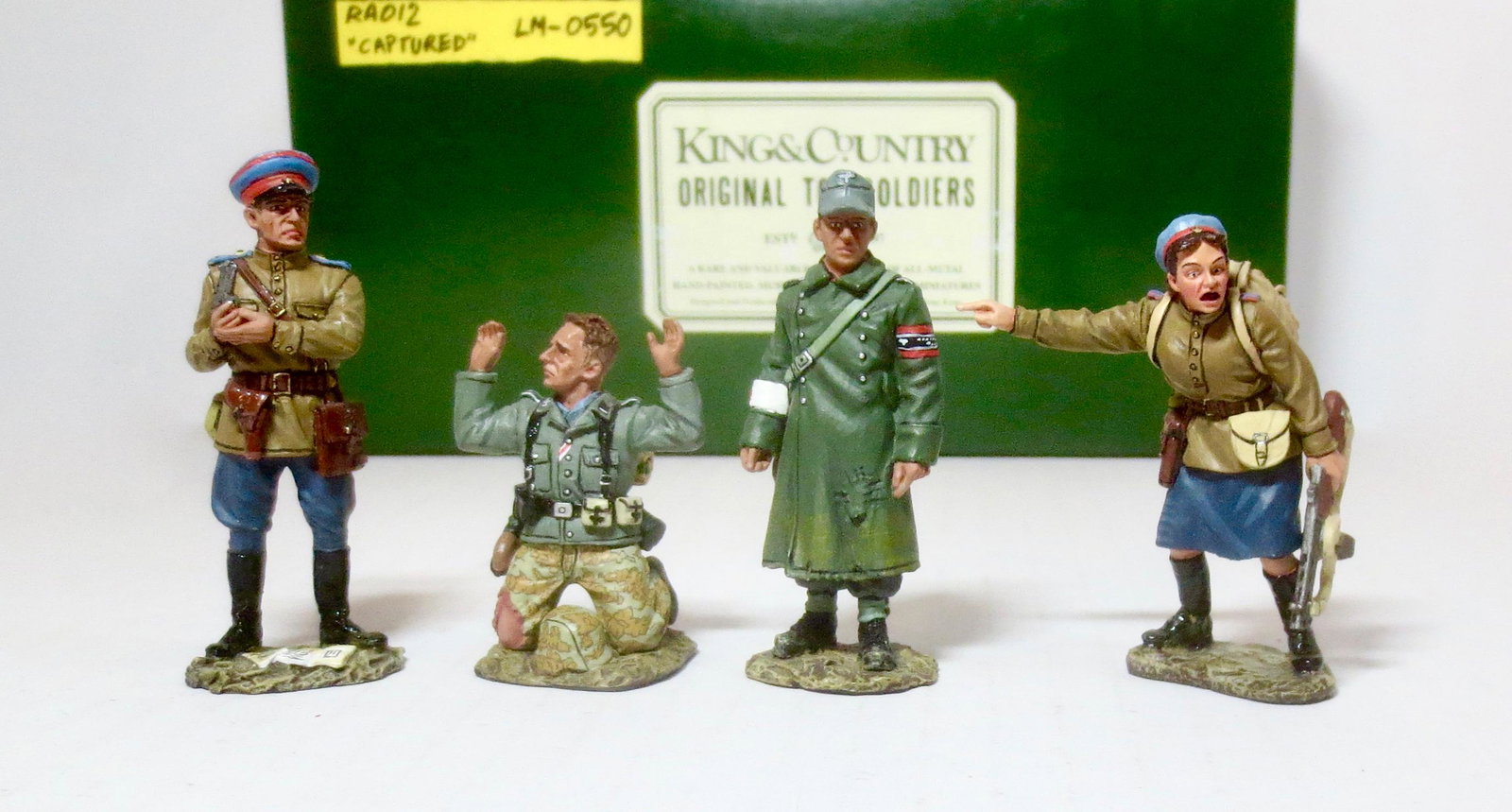 King & Country #RA012 "Captured": Retired set. Two Germans have had the misfortune to fall into the hands of a couple of NKVD (Soviet Secret Police) officers. The standing “Volksturm” medic may be lucky and be spared for a Russian