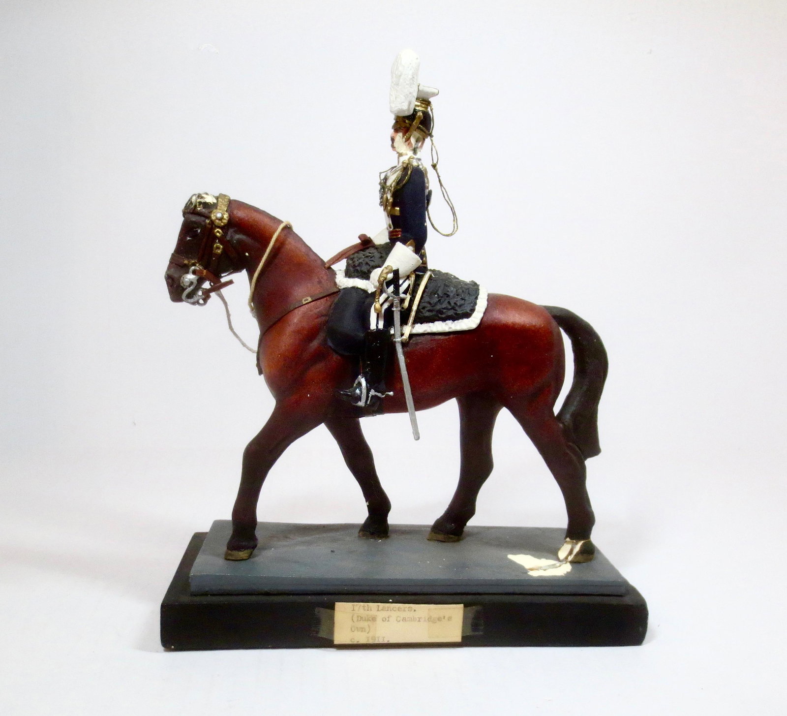H.F. Willetts 17th Lancers 1911: Circa 1966. Plaster model. Measures 9" tall on base. Poor condition (Chips on face, rear leg of horse and base). No box.