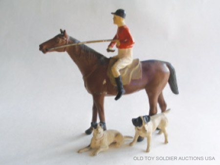 Heyde RARE Huntsman/Jockey on standing Horse: Heyde RARE Huntsman/Jockey on standing Horse with standing and lying Hounds as integral part of figure and attached to horses legs. 110mm Scale.Pre War German Circa 1930. 1 Piece. Condition Excellent