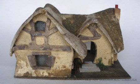 Britains Set # 1659 VERY RARE Snow White Cottage: Britains Set # 1659 VERY RARE Snow White Cottage Manufactured by Hugar. Small version without baseboard and bridge. Pre War 1938-1939. Condition Good (Lacks front door & back hinged panel, Split in on