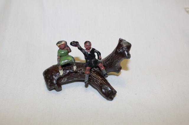 From Johillco See-Saw set: SCARCE 3 pcs, pre-war, girl and boy, and log, missing plank see-saw, 54 mm, good condition, no box.