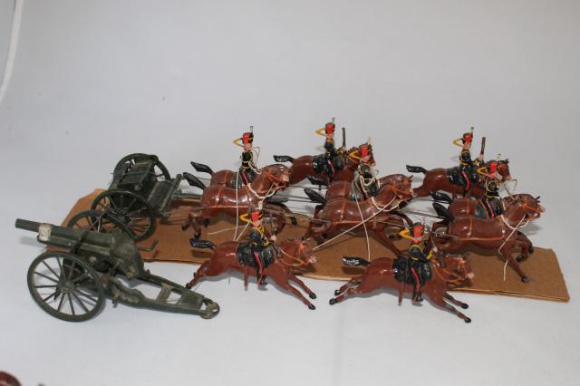 Britains set #39 Royal Horse Artillery: 12 pcs., 54 mm, missing officer, pre-war with breast harness, 6-horse team galloping with 3 drivers, 4 outrider escorts with carbines, gun, (mismatched to) limber - review order. VG, paint chips to a 