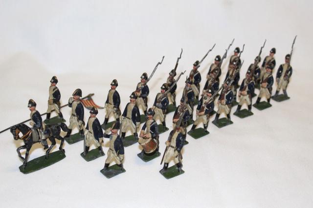 Heyde American Revolution Continental Lt. Inf.: 26-pc marching column, size 2, 48 mm, 1920s, Continental Light Infantry in blue coats, white breeches and facings. Mounted officer, 2 officers saluting, 2 officers with swords, drummer, sgt. with pike