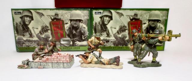 Britains World War Two Assortment: German Bazooka Anti-Tank Team #17491, U.S. 101st Airborne Mortar Crew (missing top of gun). #17141, British 8th Army "Desert Rat" Infantry #17253 (missing one figure). Boxes very good.