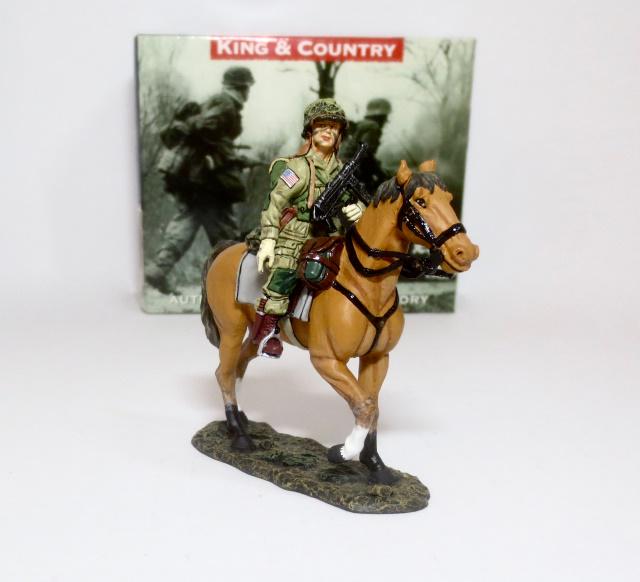 King & Country #DD071 “Horse Paratrooper”: Retired Figure. During the first couple of days following the invasion some US paratroopers used captured German cavalry horses to conduct ‘patrols’. This para also boasts a captured Schmeisser ma