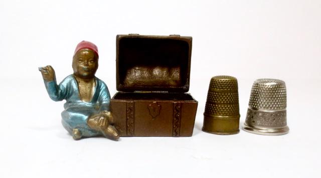 Arab With Treasure Chest Thimble Holder: Unusual piece. Complete with two thimbles. 3 pieces. Excellent condition. Unboxed.