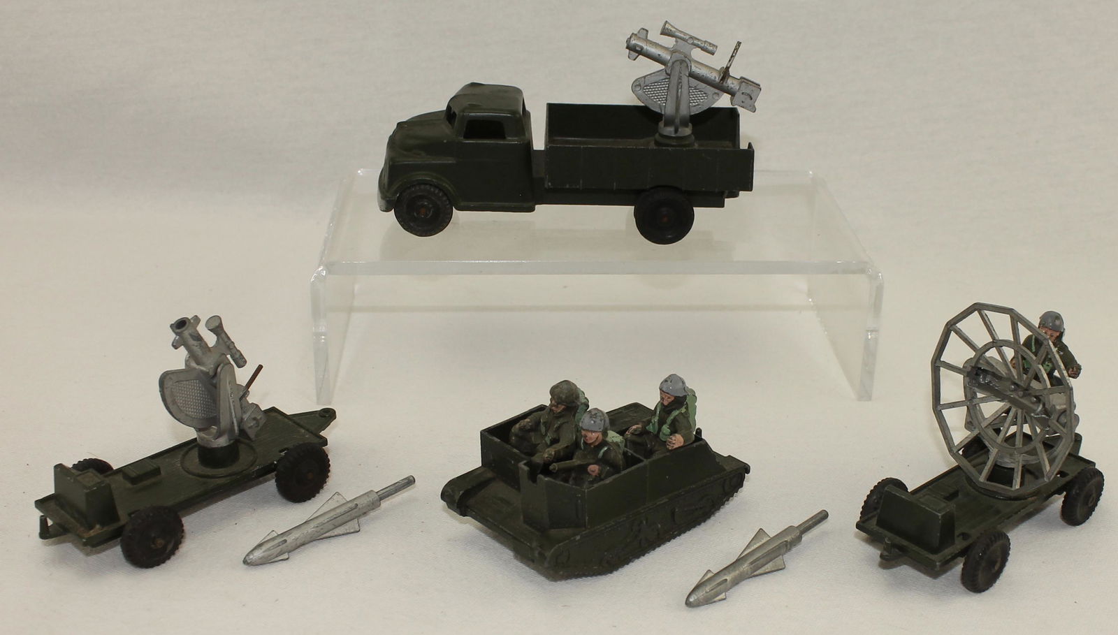 Lone Star Lot Die Cast Vehicles: Lot Includes Bren Gun Carrier with 3 Man Crew, Missile Launcher with Truck, Trailer with Radar, Trailer with Missile and 2 Extra Missiles. 10 Pieces. Condition Very Good. No Boxes.
