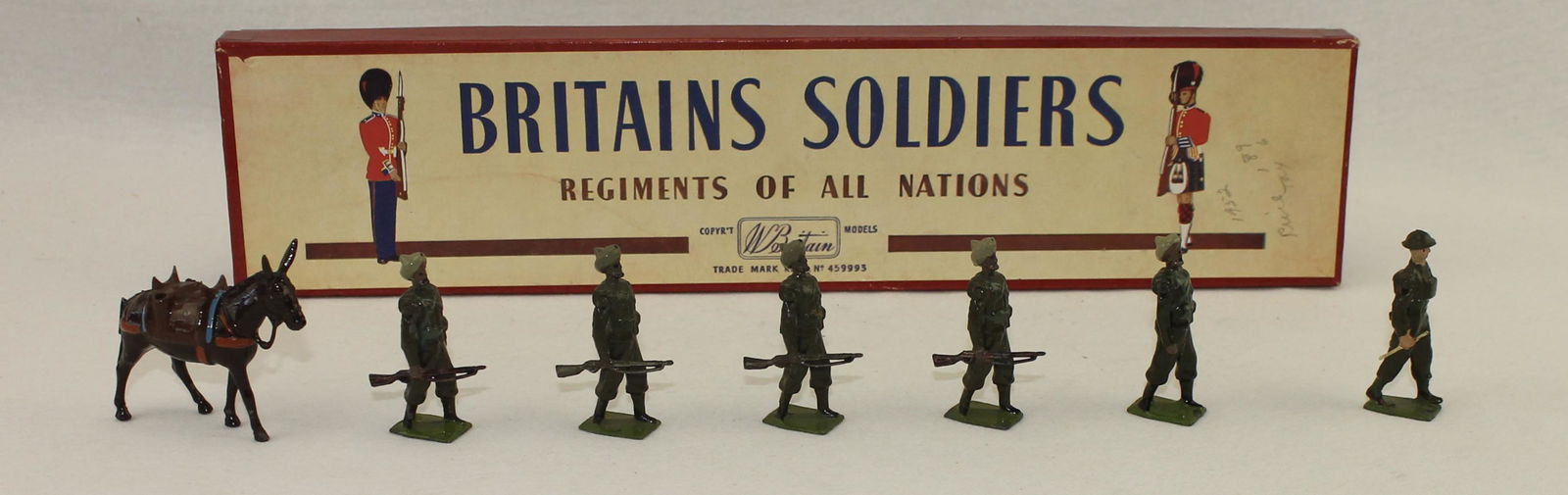 Britains #1893 Indian Army Service Corps: Post War. In ROAN Box. Officer Slight Mismatch. 7 Pieces. Condition Excellent. Box Very Good.