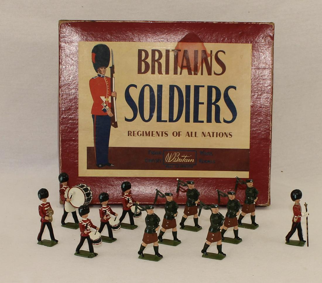 Britains #2096 Irish Guards Pipes and Drums: Post War. In ROAN Box. Metal Drums. 12 Pieces. Condition Excellent. Box Good. Edgewear. Water Stain to Label.