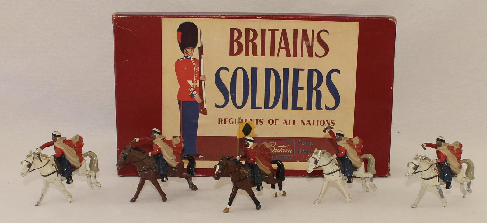 Britains #2172 Troops of the Algerian Spahis: Post War. In ROAN Box. Made 1958-60. 5 Pieces. Condition Fair to Very Good. 3 Rifle Butts Missing. Paint Chips. Box Very Good.