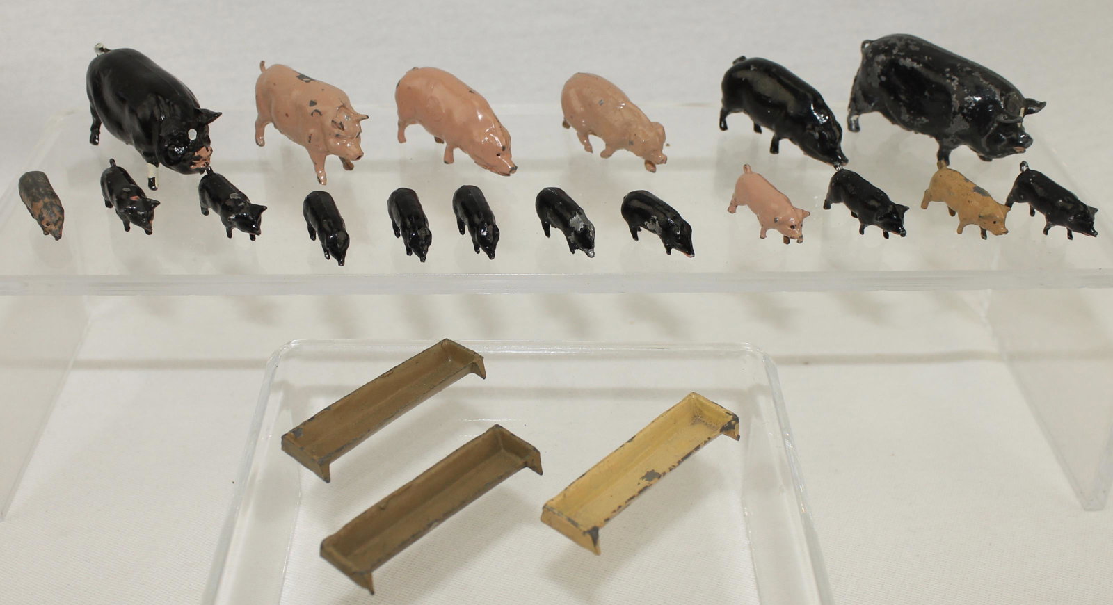 Britains Lot Farm Pigs: Farm Series. Lot includes #514 Pig, #546 Piglets and 3 Sets of #529 Large Trough. 21 Pieces. Condition Good to Very Good. No Box.